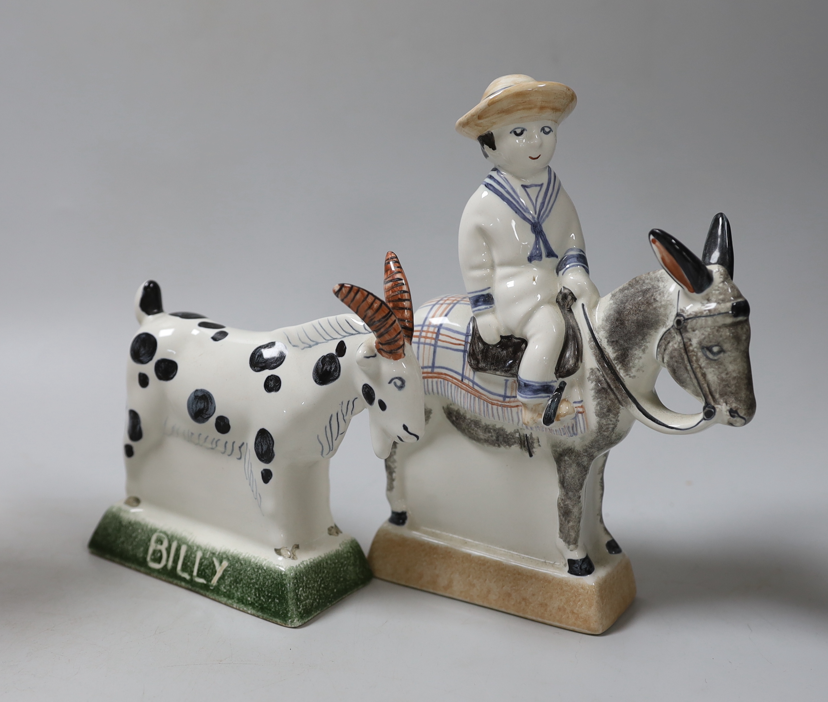 A Rye pottery Billy the goat, a boy riding a donkey, a lady on horseback and a cat, 20cm high (4)